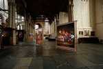 Impressie van de tentoonstelling De onzichtbaren in beeld in de Oude Kerk te Amsterdam.  A impression of the exhibition The invisble ones in focus at the Old Church in Amsterdam